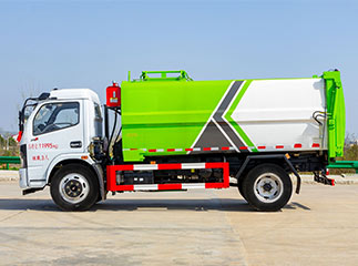 camion à ordures à chargement latéral